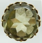 A 9ct gold ring set with a large round cut citrine, 7.3g, size M