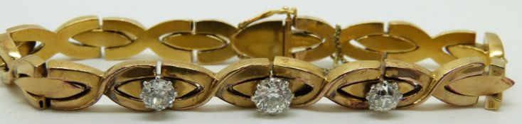 A 14ct gold bracelet set with three round cut diamonds of approximately 0.5ct, 0.35ct & 0.35ct, 19.