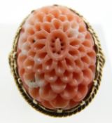A 9ct gold ring set with a carved coral flower, 5.8g, size O/P