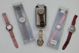 Six Swatch wristwatches including some chronographs and some in original boxes.