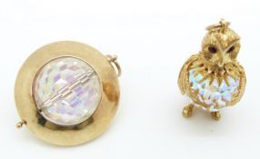 A 9ct gold pendant in the form of an owl set with a crystal bead and another 9ct gold charm set with