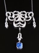 A platinum necklace set with round cut diamonds in a stylised foliate design and a cushion cut