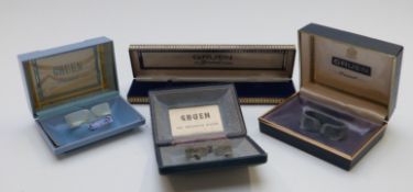 Four Gruen wristwatch boxes all marked 'The Precision Wristwatch', some with gilt decoration.