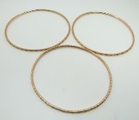 Three 9ct rose gold bangles with textured detail, Chester 1918, maker C.H, 29.5g