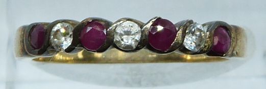 A 9ct gold ring set with rubies and alternating cubic zirconia, 1.9g, size O