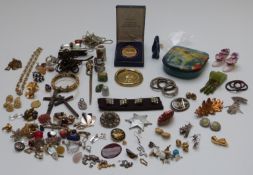 A collection of jewellery including silver brooch, silver scarf ring, silver pendants, earrings etc