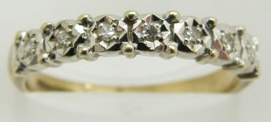 A 9ct gold half eternity ring set with diamonds, 2.1g, size M