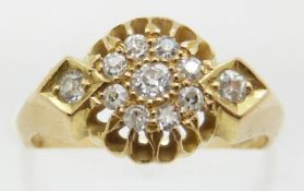An 18ct gold ring set with old cut diamonds, 3.6g, size J