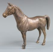 Hallmarked silver novelty model of a standing horse, London 1968 maker's mark SMD, length 16cm,