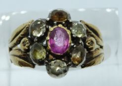 Victorian ring set with a pink sapphire surrounded by old cut white sapphires, 5.3g, size K