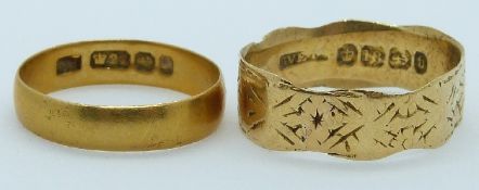A 22ct gold ring/ wedding band, Birmingham 1896 and an 18ct gold wedding band/ ring (Birmingham