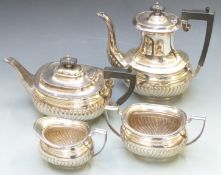 Four piece silver plated tea service by Barker Brothers, with lobed lower section, height of tallest