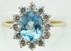 A 9ct gold ring set with a topaz and cubic zirconia, 2g, size N