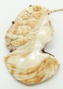 A cameo brooch depicting a young woman, 3 x 4.7cm