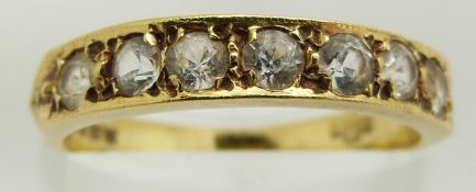 An 18ct gold half eternity ring set with cubic zirconia, 2.8g, size L
