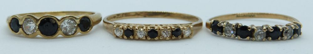 Three 9ct gold rings set with sapphires and cubic zirconia, 5.1g