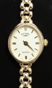 Rotary 9ct gold ladies wristwatch with gold hands and baton markers, champagne dial and quartz