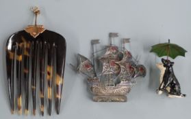 A silver filigree and enamel boat, height 6.5cm, a painted model of two dogs sheltering under an