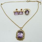 An 18ct gold ring set with an oval amethyst, a yellow metal pendant marked 333 set with an