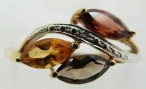 A 9ct gold ring set with marquise cut garnet, citrine and quartz, 1.5g, size O