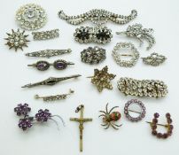 A collection of paste brooches including Victorian paste brooches, a silver brooch set with paste