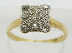 An 18ct gold ring set with diamonds in a square platinum setting, 3.1g, size Q