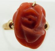 A yellow metal ring set with carved coral rose, 3.2g, size J/K