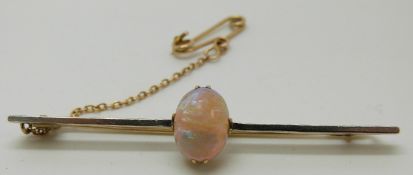 A 15ct gold brooch with a set with an opal cabochon of approximately 2.4ct, in original box