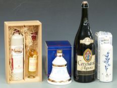 Five bottles of assorted alcohol comprising cased cornwine and Ceylon Cinammon, boxed Bell's Extra