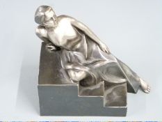 Art Deco style cast silvered metal figure of a female nude reclining on steps, H15.5cm