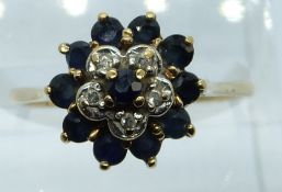 A 9ct gold ring set with sapphires and diamonds in a cluster, 2.6g, size O