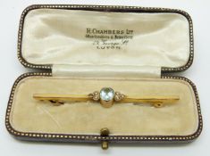 A 9ct gold brooch set with a faux aquamarine and seed pearls, in original box