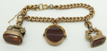 A 9ct rose gold bracelet, 9ct rose gold fob set with agate and bloodstone and two other fobs, 37.3g