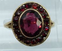 A 9ct gold ring set with garnets, 2.9g, size O
