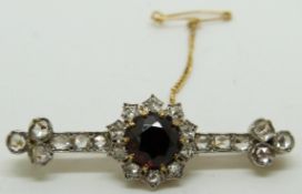 Victorian brooch set with a round cut garnet and rose cut diamonds, length 4cm