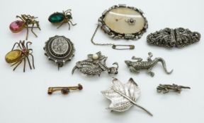 A collection of brooches including Victorian silver, silver metamorphic brooch/clips set with