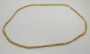 An 18ct gold necklace made up of beaded links, 10g