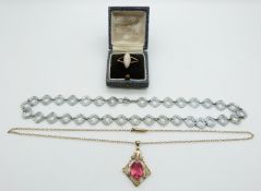 A 9ct rose gold ring set with a cameo (2.1g), rolled gold pendant and a yellow metal chain