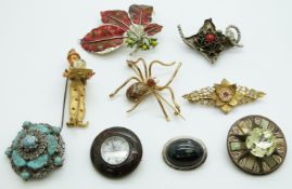 A collection of brooches including Trifari, Miracle, spider, compass etc