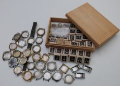 A large collection of wristwatch parts, most in original boxes together with various wristwatch
