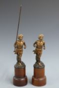 Pair of Bergman cold painted bronze figures of running men with turbans, one carrying a spear, one