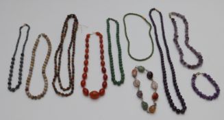 A collection of beaded necklaces including amethyst, glass, agate etc