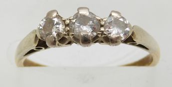 An 18ct gold ring set with three diamonds, 2.1g, size K