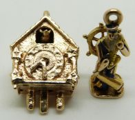 A 9ct gold charm in the form of a cuckoo clock with movable hands and cuckoo and a 9ct gold charm in