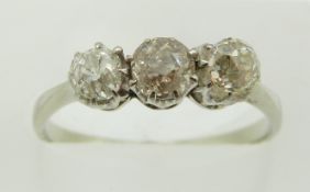 An 18ct white gold ring set with three old cut diamonds, 2g, size N