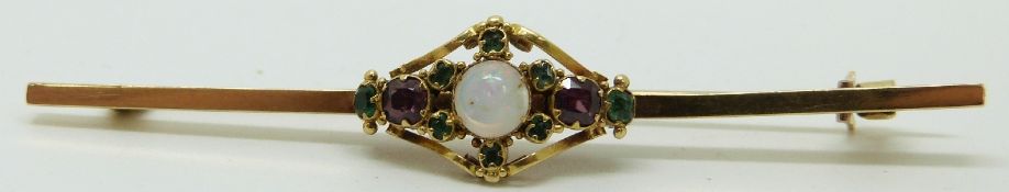A 9ct gold bar brooch set with section of a Victorian opal, tourmaline and garnet ring