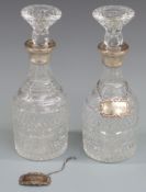 Pair of hallmarked silver mounted cut glass decanters with two hallmarked silver sherry bottle