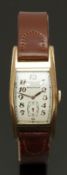 Waltham tonneau shaped gentleman's wristwatch with subsidiary seconds dial, gold hands and Arabic