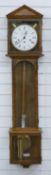 Hermle German three train chiming regulator wall clock in oak case with apex top and glass panels to