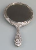 Edward VII hallmarked silver hand mirror with embossed decoration including cherubs riding a